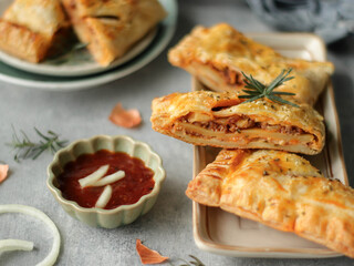 Beef Bolognaise Pastry, Beef Bolognaise Strudel, savory snack made from pastry with minced beef and bolognaise sauce filling