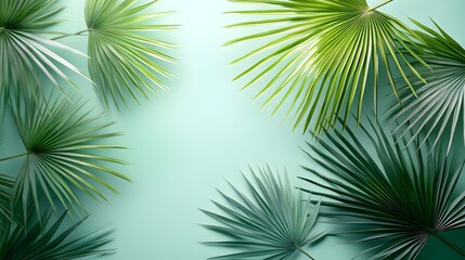 Obraz premium Tropical palm leaves, fan palm fronds, vibrant green foliage, pale mint green background, minimalist botanical composition, organic shapes, natural textures.