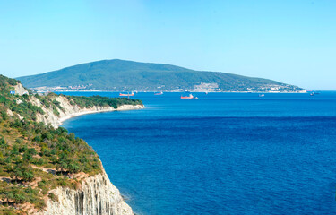 A breathtaking scenic view of the coastline showcasing clear blue waters alongside an island