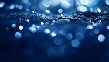 abstract dark blue background of water and small bubbles bokeh