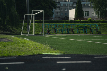 The school stadium, football gates on the field. Rubber Treadmill