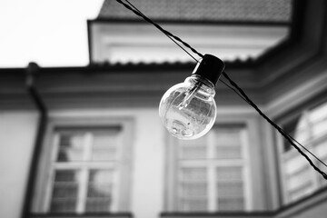 Close up of a light bulb outdoors in black and white