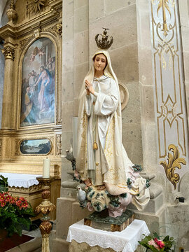 Image of Our Lady of F&aacute;tima with Crown and hands folded in prayer in the Basilica of Santuario do Sameiro in Bom Jesus do Monte, Braga, Portugal.