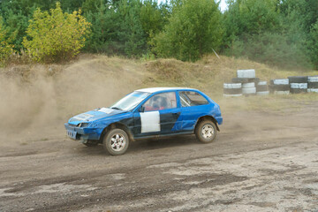 Autocross on a dirt track. rally race. Off-road racing. Training races of racing drivers. Modern...