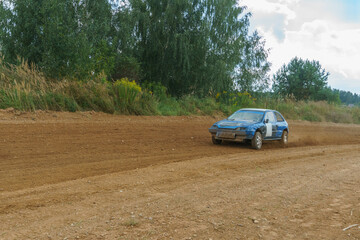 Autocross on a dirt track. rally race. Off-road racing. Training races of racing drivers. Modern modified cars on the road.