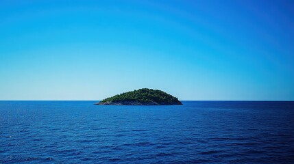 Naklejka premium A lone island in the middle of the sea, surrounded by deep blue water and a clear, cloudless sky.