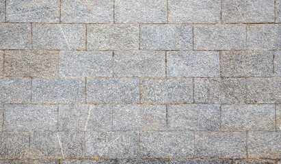 Stone wall in old town China for background.