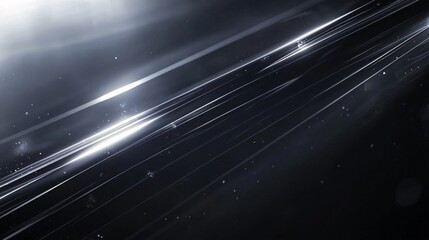 Abstract light streaks create a dynamic and futuristic background with a sleek, dark appearance.