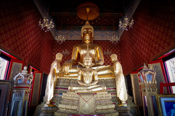 Thailand, August 11, 2024, Wat Phitchaya Yatikaram Worawihan, Golden Buddha statue in ornate temple...