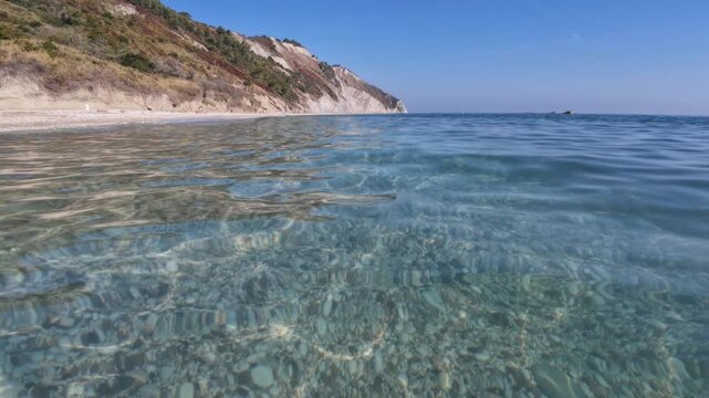 Ancona Conero regional park and View of Mezzavalle beach with fantastic and transparent water at early morning, Marche region, Italy
