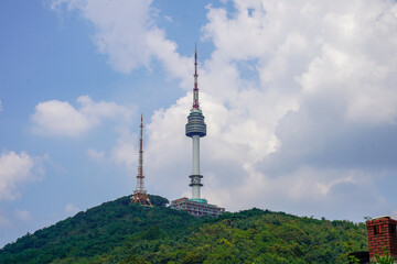 Fototapeta premium Namsan Tower, a landmark in Seoul, South Korea, with the surrounding cityscape in the background.