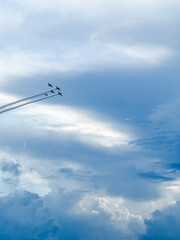Five airplanes ply in the clouds 