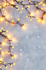 Colorful Christmas lights on gray background. Holiday decoration concept. Image for greeting cards, party invitations, and seasonal banners with copy space.