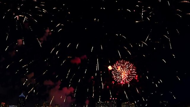 Night Sky Fireworks Display: A breathtaking display of fireworks illuminates the night sky, creating a mesmerizing spectacle of light and color. The vibrant bursts paint the darkness with streaks of r