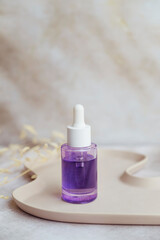 Bakuchiol serum and jade roller on shadows background 