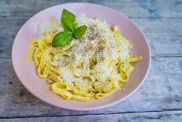 Tagliatelle with parmesan and basil  .Italian pasta 