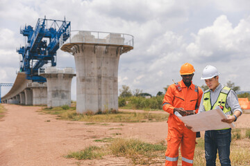 Surveyor engineer worker making measuring with theodolite tool equipment at construction site. Surveyors or explorer view construction sites or check security