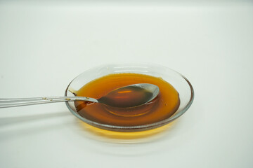 Raw pure Honey from the mountains cliff of Nepal Himalayas Organic Honey Dripping in plate