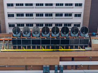 Cooling towers in data center building. Air conditioning cooling towers in front of building with...