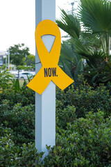 “Bring them home now” Installation of yellow ribbons in park, tied between trees as a symbol advocating for the return of hostages and raising awareness for those who are missing or held captive.