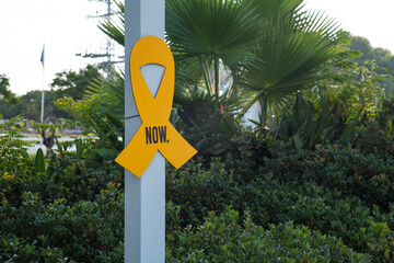 “Bring them home now” Installation of yellow ribbons in park, tied between trees as a symbol advocating for the return of hostages and raising awareness for those who are missing or held captive.