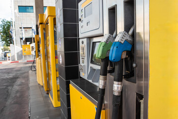Gas station scene with Gasoline, petrol or diesel pump nozzle. Concept of gasoline prices and fuel...