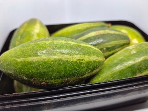 pointed gourd or parwal : "Fresh, vibrant pointed gourd with smooth, green skin, ideal for healthy dishes and traditional recipes, showcasing natural, crisp freshness."