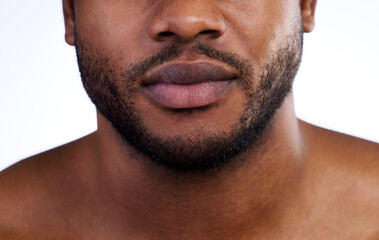 Obraz premium Black man, jaw and skincare, beard grooming and face health for beauty, aesthetic or skin on white studio background. Closeup of guy, model and facial hair for dermatology, wellness or cosmetics