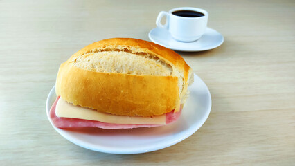  French Bread on the plate and cup of coffee with copy space.
