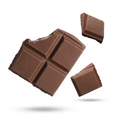 Pieces of sweet chocolate falling on white background