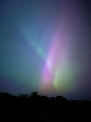 Gorgeous and rare extreme solar storm creating rare Northern Lights or Aurora Borealis in an amazing light show over Onchan on the Isle of Man