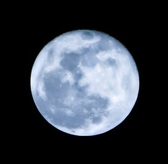 The mesmerising full moon shines brightly in a clear night sky © panmaule