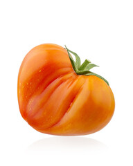 Red ripe organic tomatoes in a plate on the table