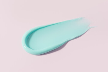 Macro smears of multi -colored paint on a pink background