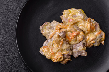 Delicious boiled beef or pork tongue sliced with carrots, onions, sour cream