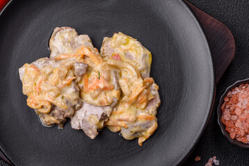 Delicious boiled beef or pork tongue sliced with carrots, onions, sour cream