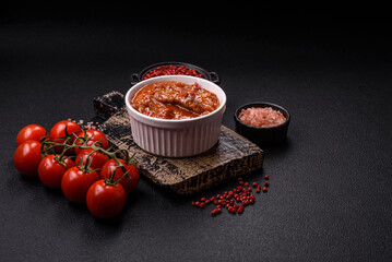 Thai Asian dish with meat, hot pepper, tomato sauce and sesame