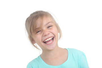 close up portrait of a little girl laughing on white background