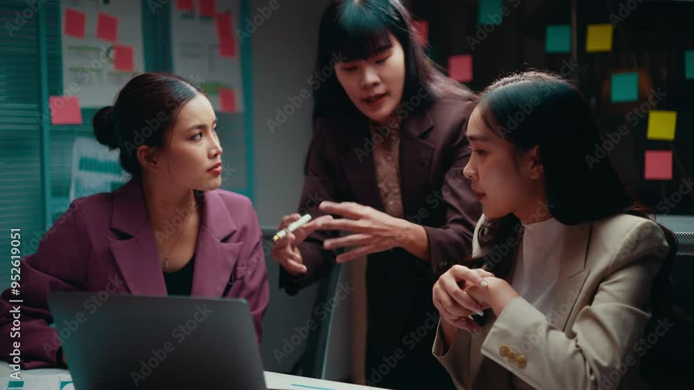 Poster three businesswomen are working late in the office. they are having an intense discussion about a pr