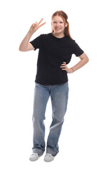 Fototapeta premium Teenage girl showing v-sign on white background