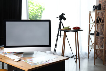 Shooting food in photo studio with professional equipment, focus on computer