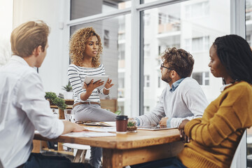 Business people, brainstorming and planning in meeting, tablet and conversation with design company. Group, teamwork and startup with feedback for project, cooperation and professional with proposal