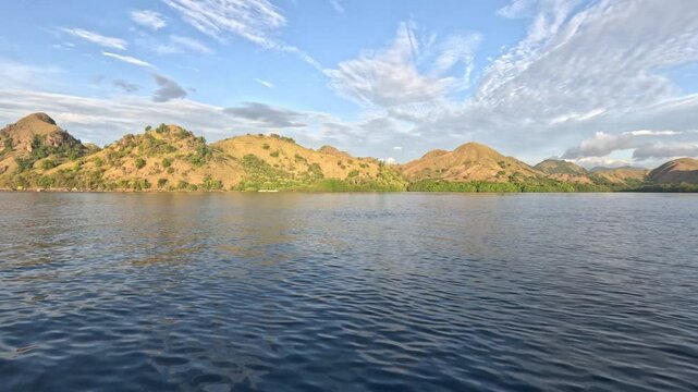 Peaceful view from the ocean of Rinca island