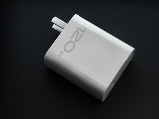 A phone charger  on a black background
