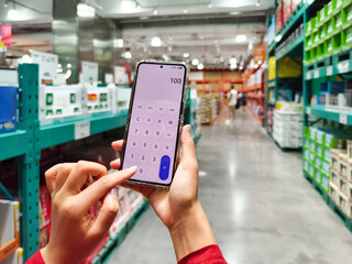 person using a phone in supermarket