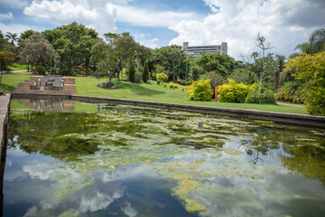 Obraz premium Lake in a public outdoor park surrounded by green trees and exercise toys in Jundiai, Sao Paulo, Brazil