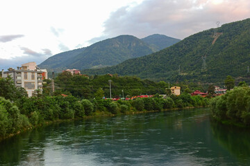 Fototapeta premium Natural river water flowing through greenery