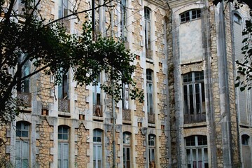 Old buildings in Parque Dom Carlos I, located in Caldas da Rainha, Portugal.  These historic stone structures are set amidst lush greenery, creating a peaceful and picturesque scene.