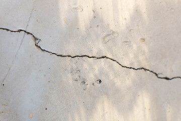 Crack in concrete wall affected with earthquake and collapsed ground