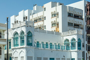 Traditional and modern arab white buildings with decorated windows and balconies, Mutrah, Muscat,...